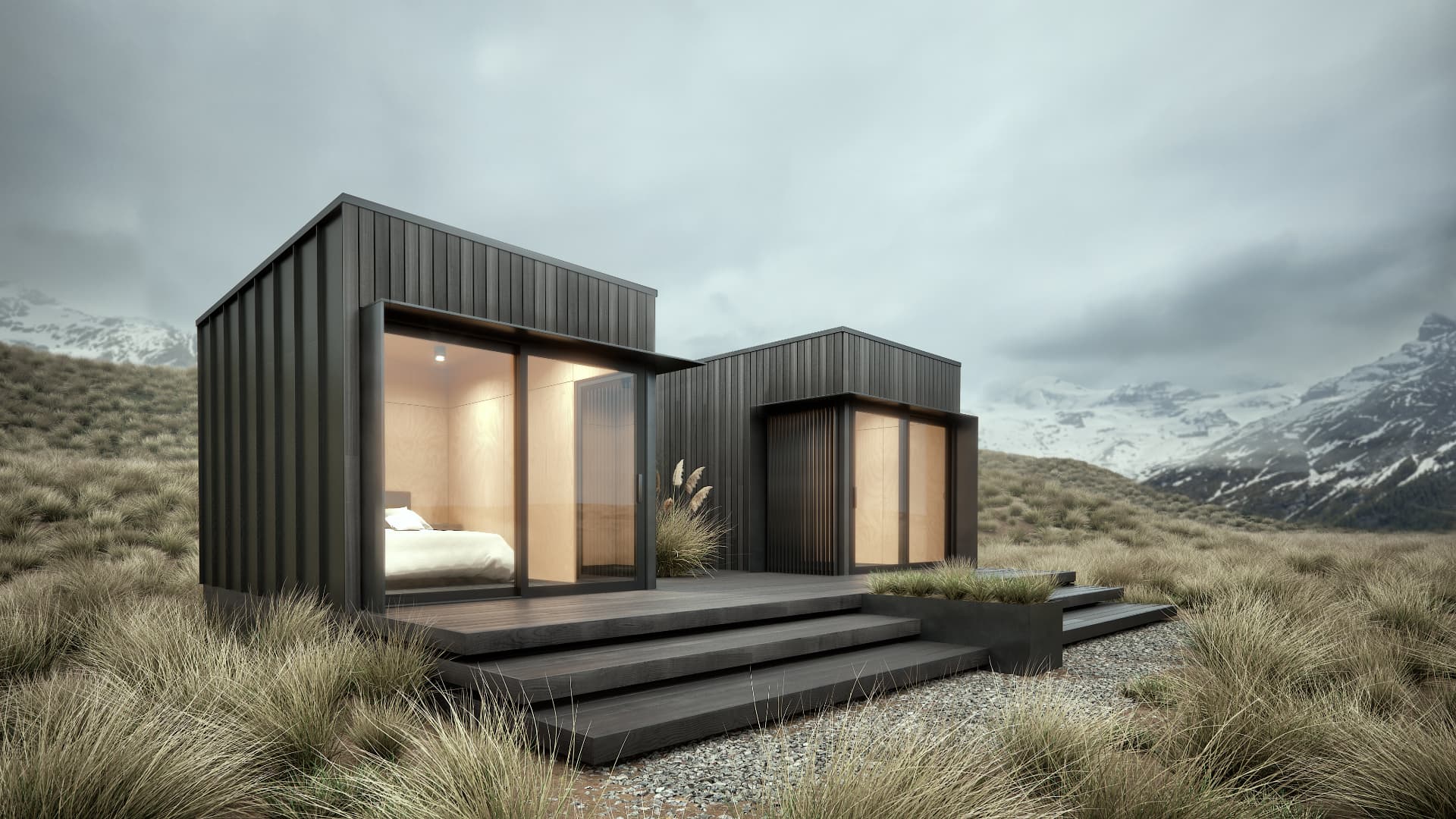 Dark-clad modular dwelling with twin glazed volumes in an alpine landscape