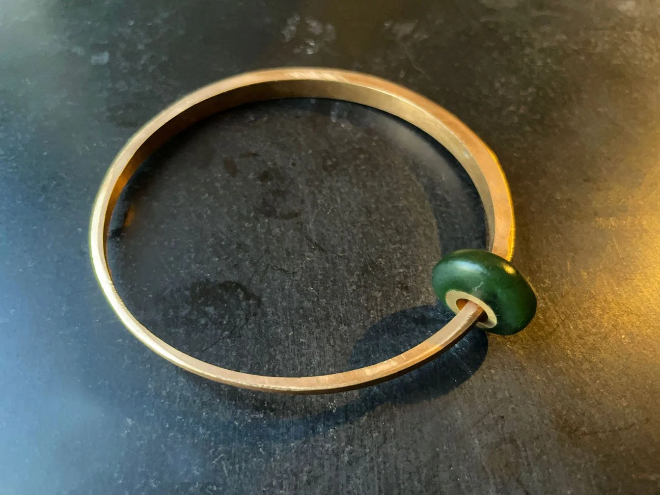 Bangles with pounamu bead, alternate view