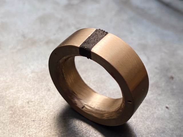 Wide cast bronze ring with hand-finished stone inlay