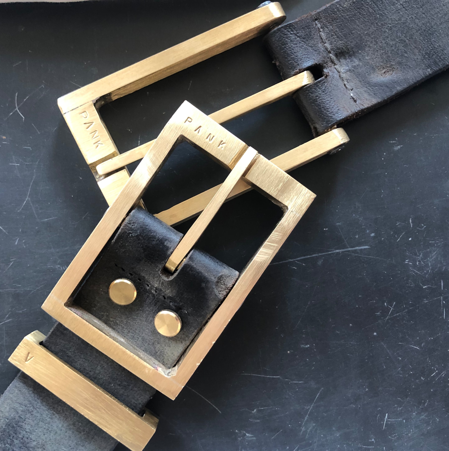 Leather belts with cast brass buckles – PANK stamped hardware