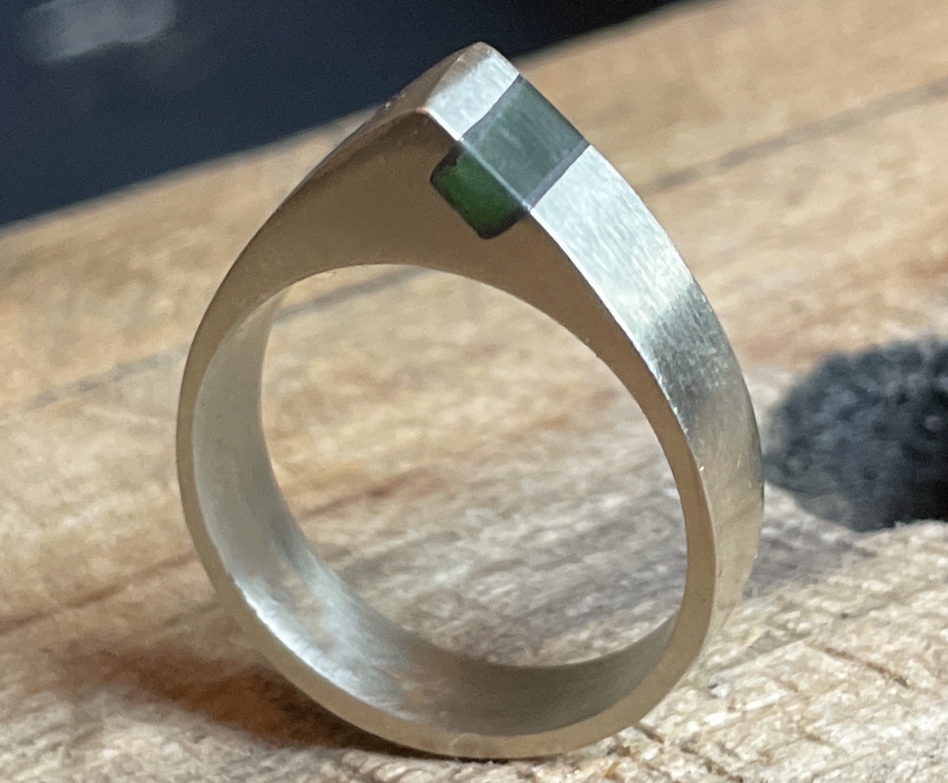 Hand-finished silver ring with inset green pounamu
