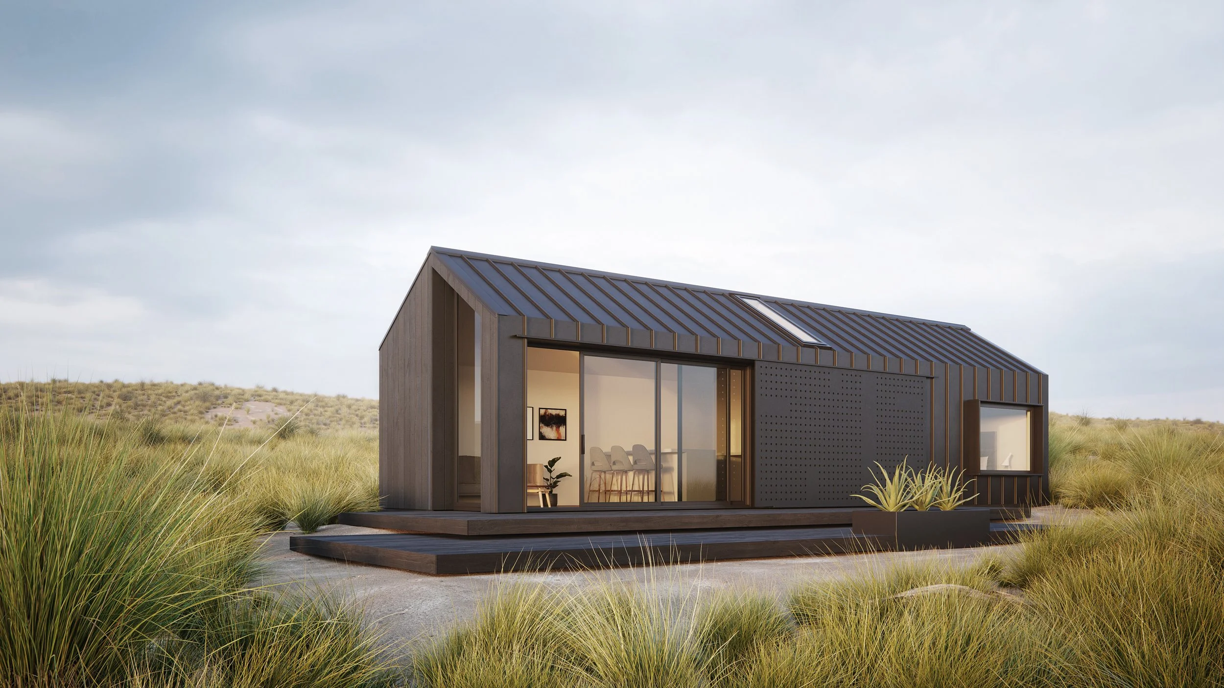 Dark gabled house with large glazing in open landscape