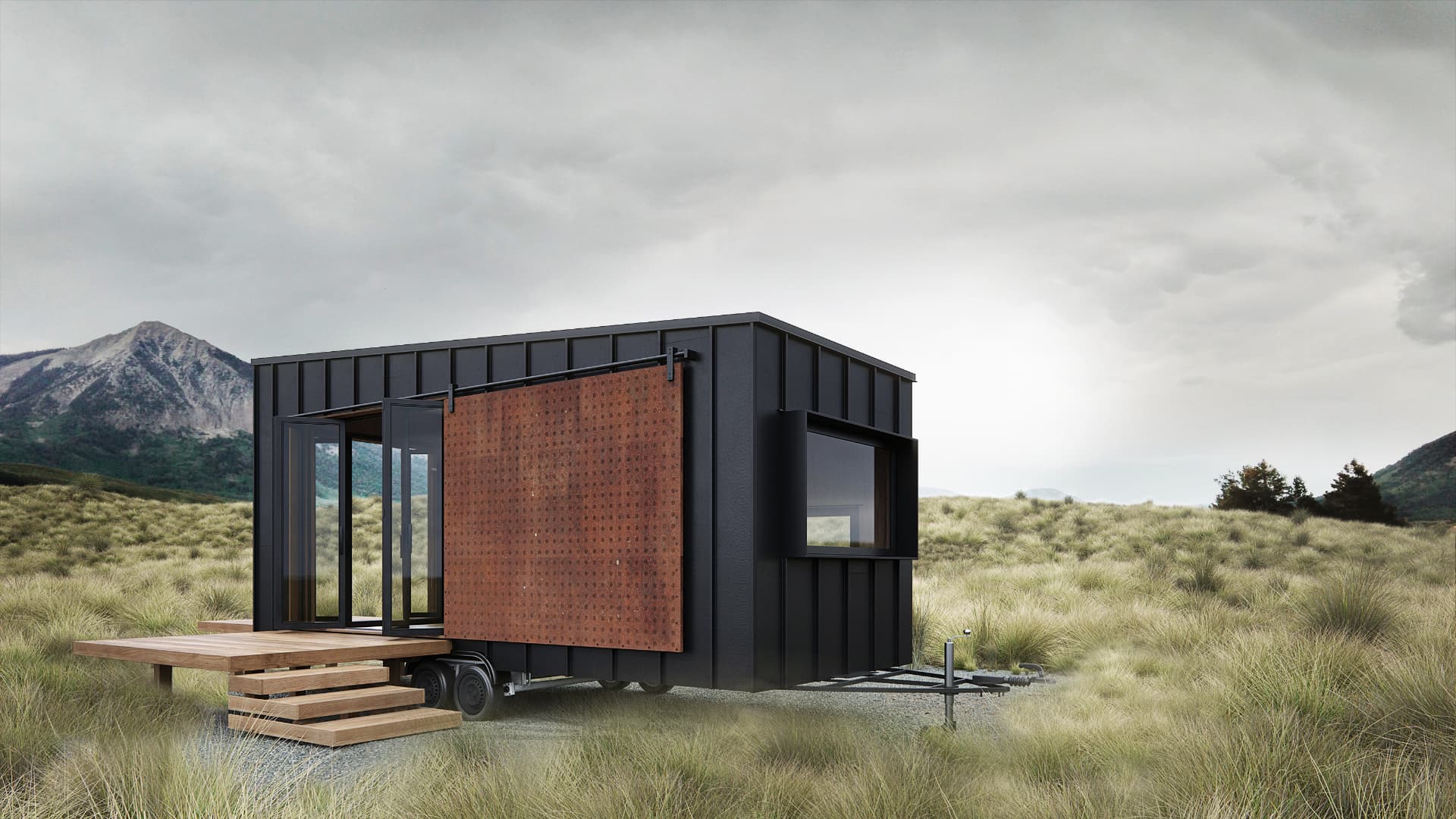 Compact modular dwelling with a rust-toned sliding screen and timber entrance steps
