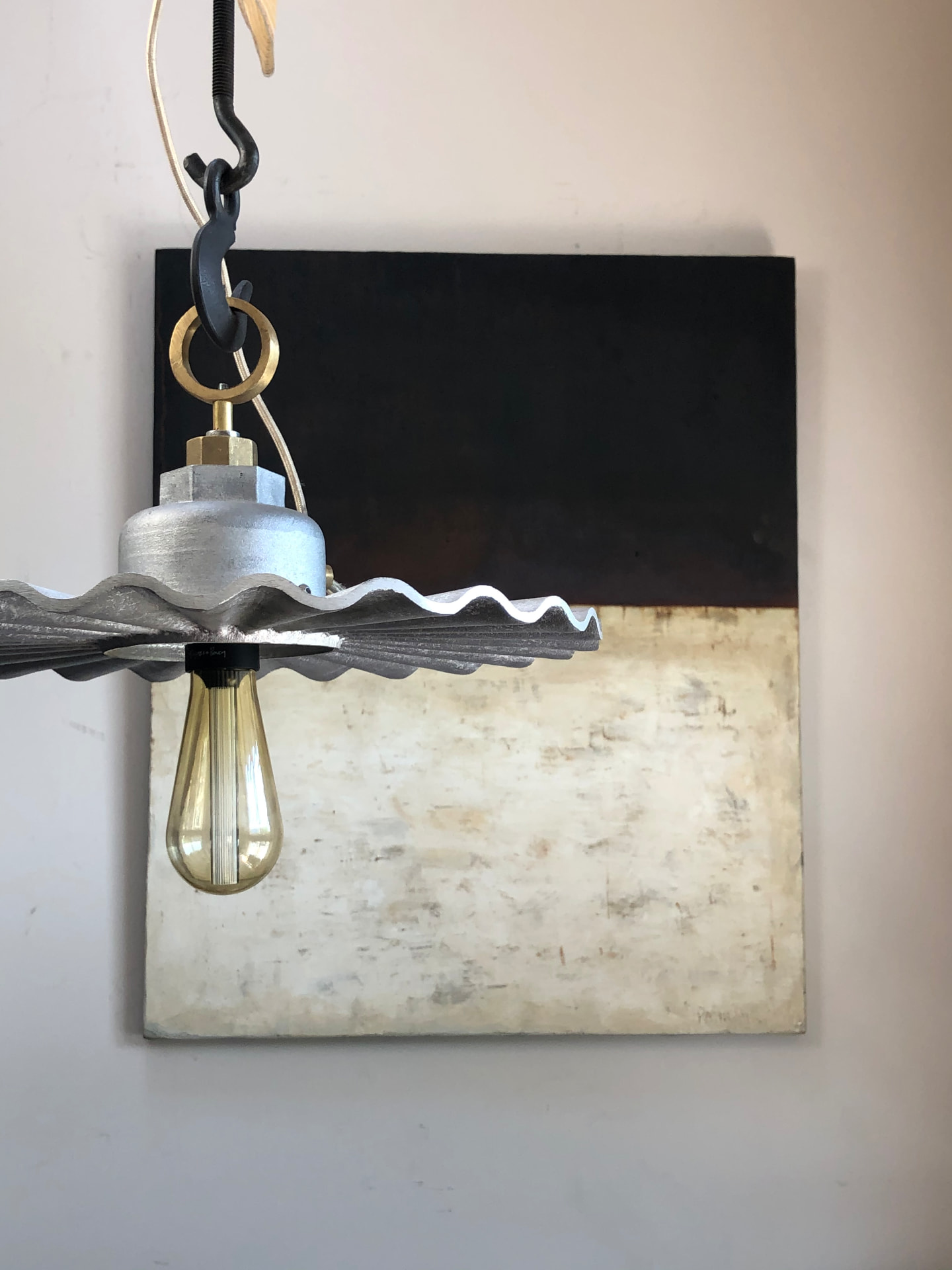 Pressed steel pendant light hanging in interior