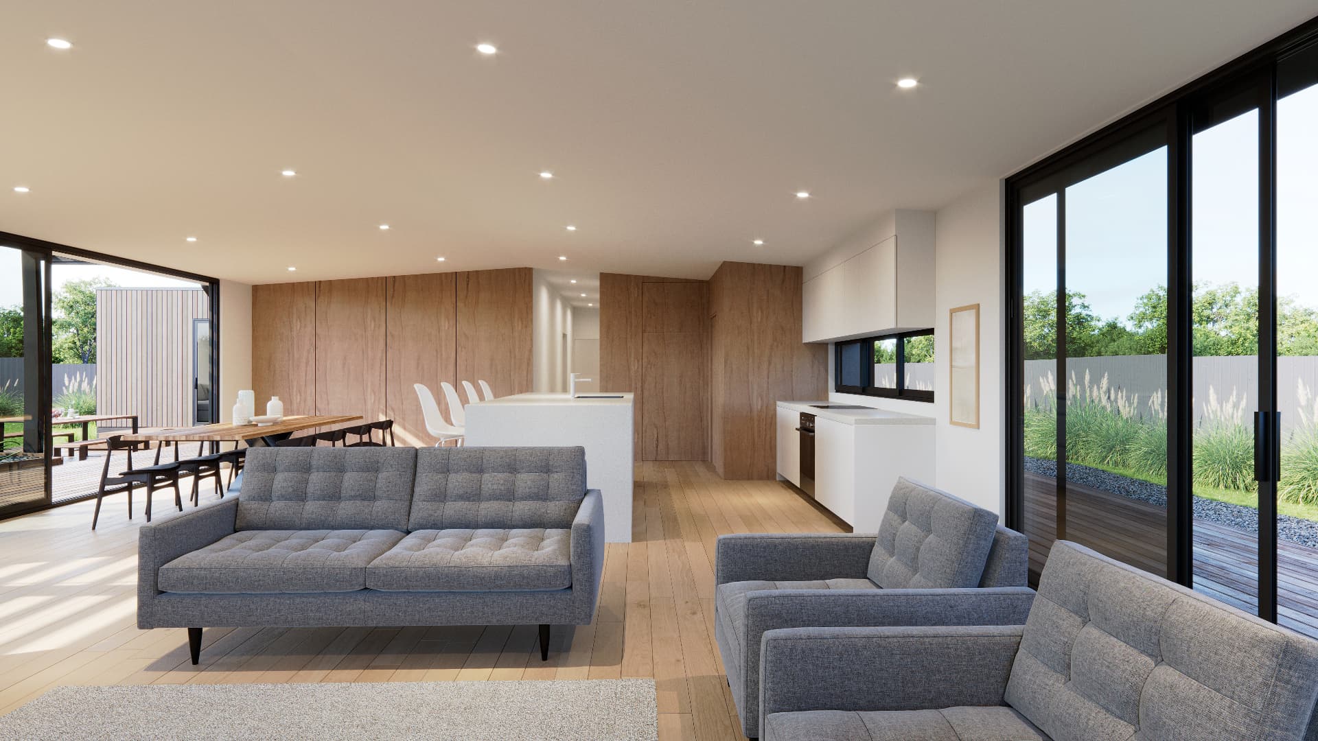 Open-plan modular dwelling living and dining interior with timber finishes and full-height glazing